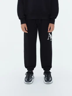 AMIRI STAGGERED SCRIBBLE SWEATPANT
